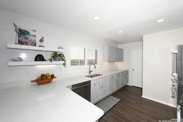 kitchen with decorative backsplash, sink, stainless steel appliances, and dark wood-type flooring