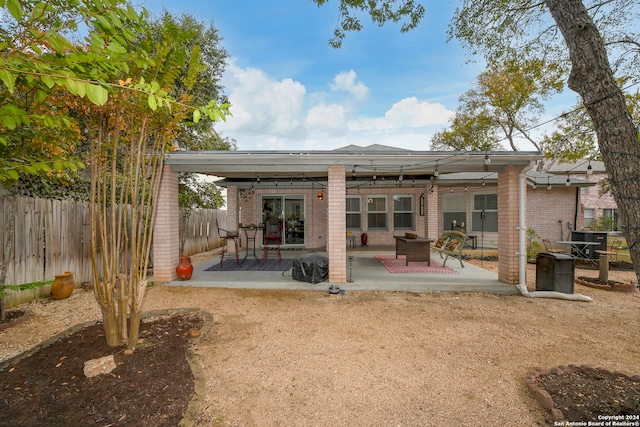 rear view of house featuring a patio