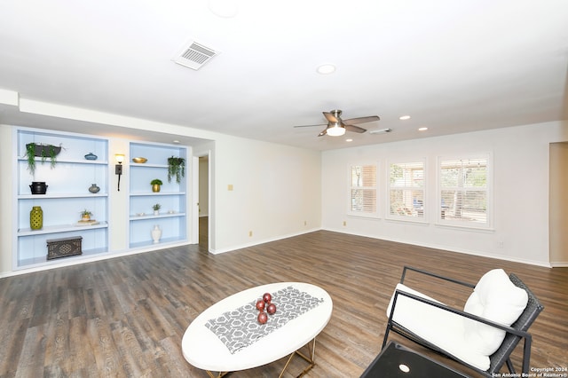 sitting room featuring dark hardwood / wood-style flooring and ceiling fan