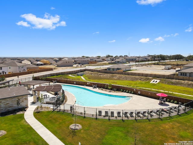 view of pool featuring a yard and a patio area