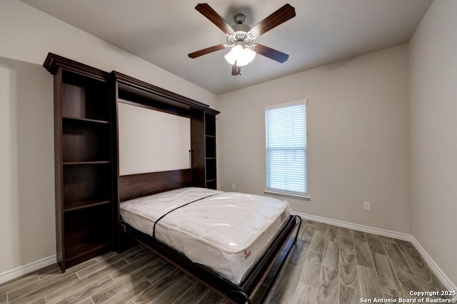 unfurnished bedroom featuring hardwood / wood-style flooring and ceiling fan