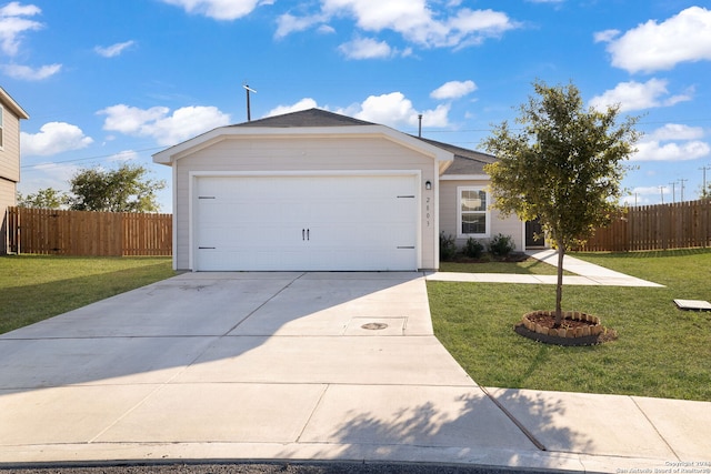 single story home featuring a garage and a front lawn