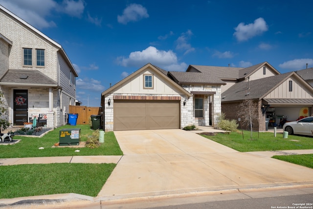 view of front of home featuring a garage and a front lawn