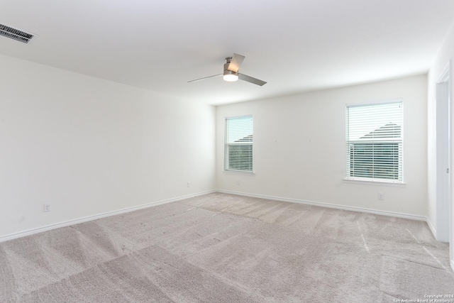 3254 Old Almonte Dr, San Antonio, TX 78224 - unfurnished room featuring light colored carpet, a ceiling fan, and baseboards