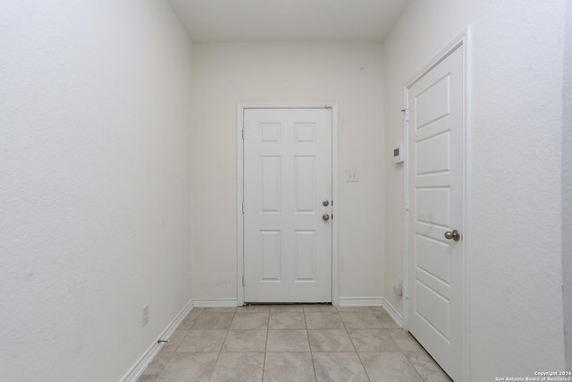 3254 Old Almonte Dr, San Antonio, TX 78224 - doorway with light tile patterned flooring and baseboards