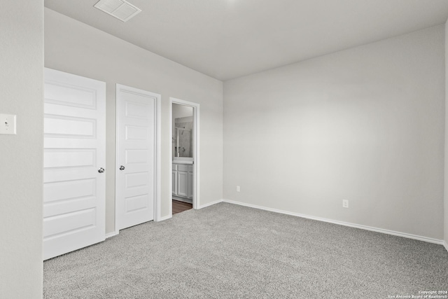 2087 Olivia Dr, New Braunfels, TX 78130 - unfurnished bedroom with carpet, baseboards, and ensuite bathroom