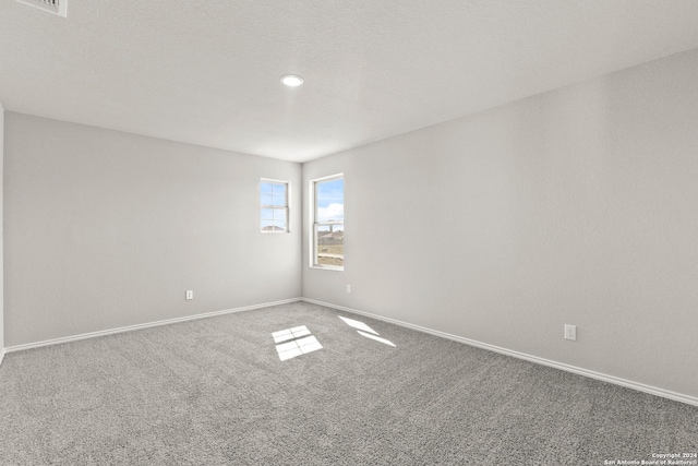 2087 Olivia Dr, New Braunfels, TX 78130 - carpeted empty room with baseboards and recessed lighting