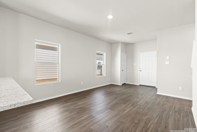 2087 Olivia Dr, New Braunfels, TX 78130 - spare room featuring dark wood-style flooring, baseboards, and recessed lighting