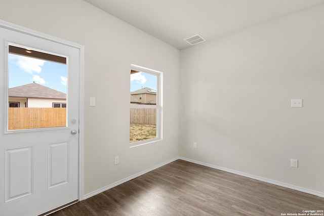 doorway with dark hardwood / wood-style flooring