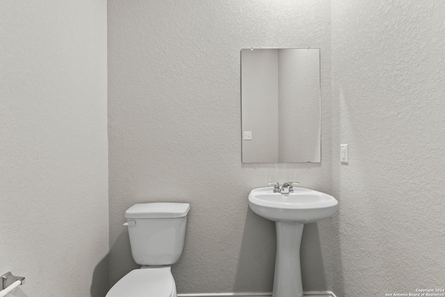 2087 Olivia Dr, New Braunfels, TX 78130 - bathroom featuring toilet and a textured wall