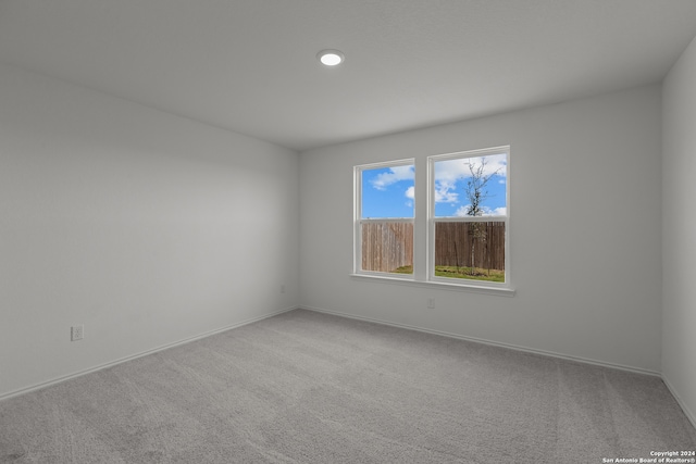 spare room featuring carpet flooring