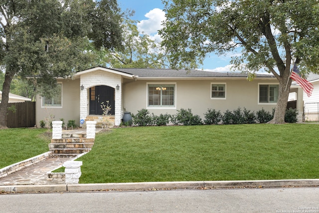 ranch-style house with a front yard