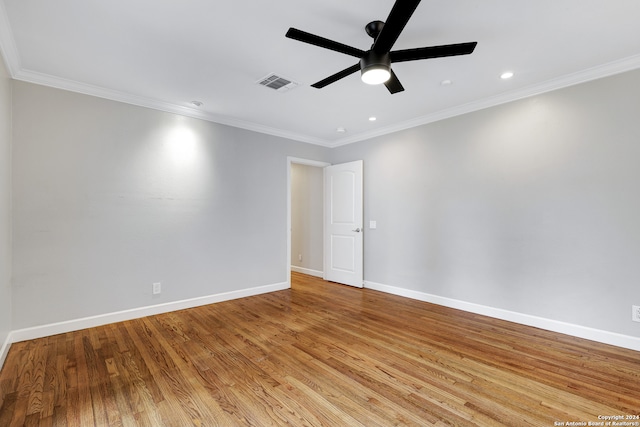 spare room featuring crown molding, ceiling fan, and light wood-type flooring