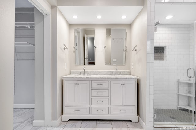 bathroom with vanity and walk in shower