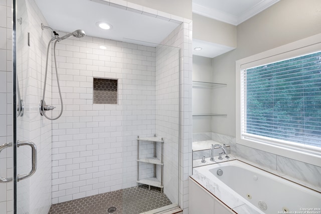 bathroom featuring separate shower and tub and crown molding