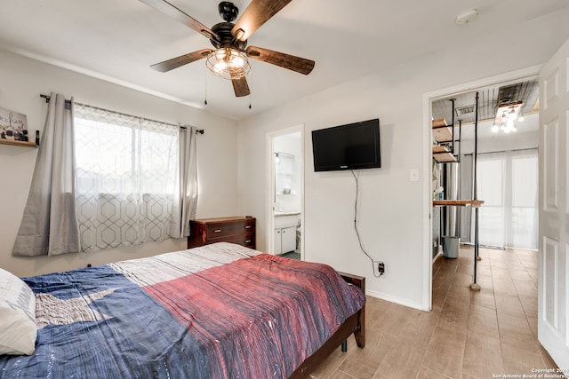 bedroom featuring ceiling fan, light hardwood / wood-style floors, and ensuite bathroom