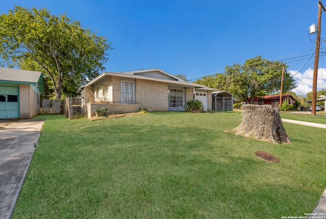 ranch-style home with a front yard and a carport