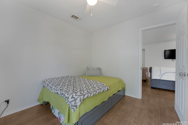 bedroom featuring wood-type flooring and ceiling fan