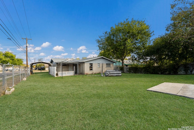 view of yard with a carport