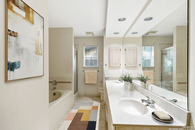 full bathroom featuring toilet, shower with separate bathtub, and a wealth of natural light