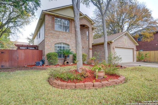 view of front facade with a garage and a front lawn