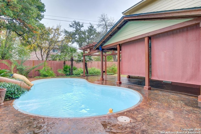 view of swimming pool featuring a patio area