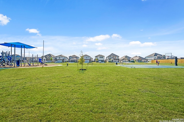 exterior space featuring a playground and a lawn