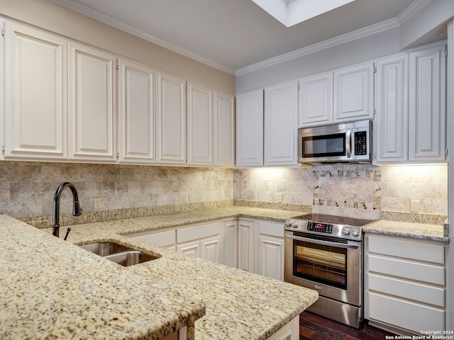 kitchen featuring white cabinetry, sink, and appliances with stainless steel finishes