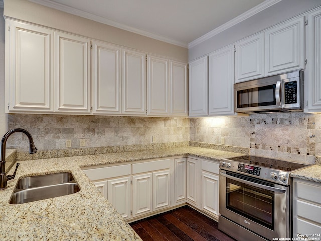 kitchen with white cabinets, dark hardwood / wood-style flooring, stainless steel appliances, and sink