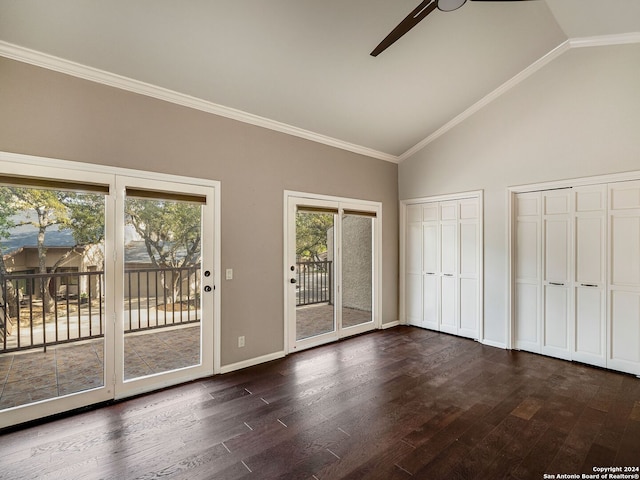 interior space with dark wood-type flooring, crown molding, ceiling fan, access to exterior, and multiple closets