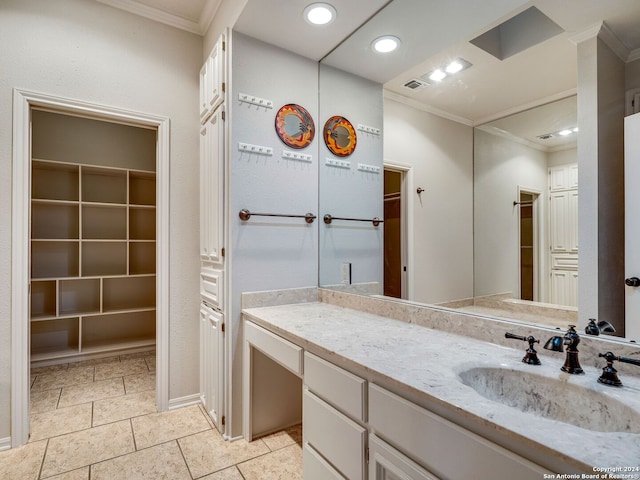 bathroom with crown molding and vanity