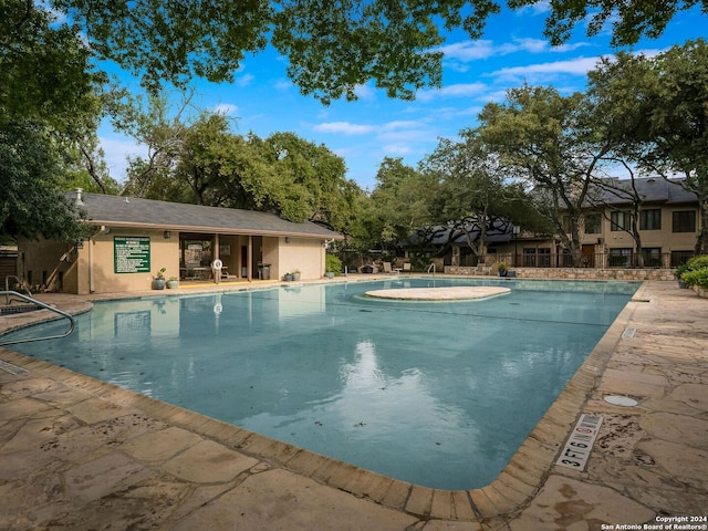 view of pool featuring a patio