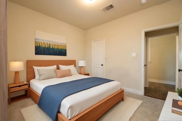 bedroom with light colored carpet