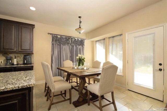 dining room featuring light tile patterned flooring