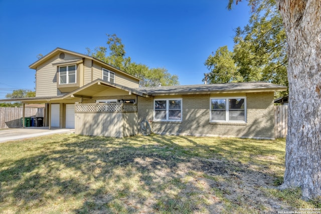 view of front of house with a front lawn and a carport