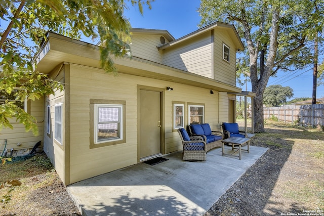 rear view of house featuring a patio area