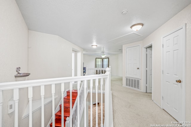 corridor with a textured ceiling