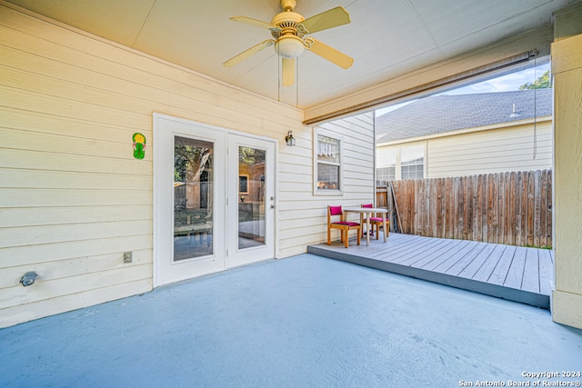 exterior space featuring a wooden deck and ceiling fan