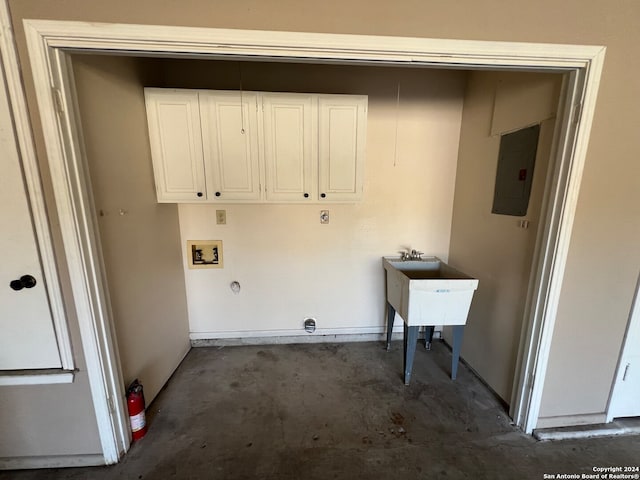 laundry area with gas dryer hookup, cabinets, electric panel, sink, and washer hookup