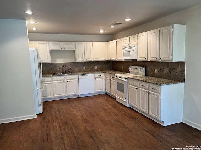 kitchen featuring white cabinets, dark hardwood / wood-style floors, and white appliances