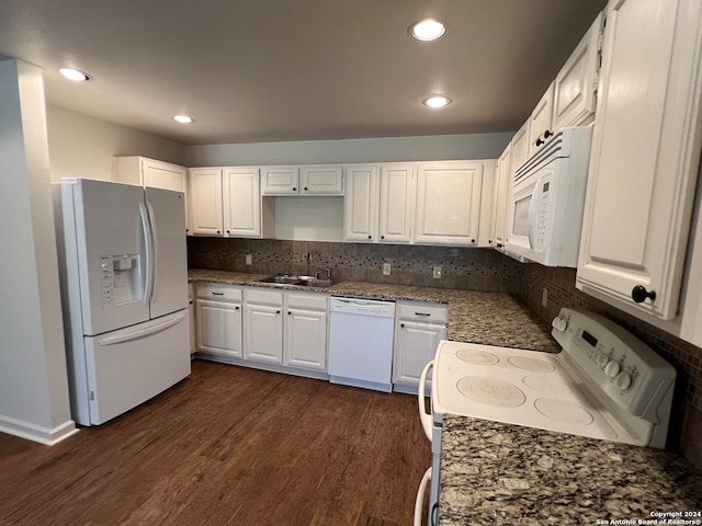 kitchen featuring white cabinetry, sink, dark hardwood / wood-style floors, backsplash, and white appliances