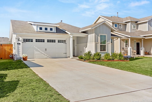 view of front facade featuring a garage and a front yard