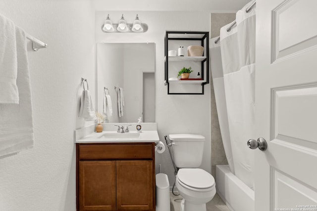 full bathroom with vanity, shower / bath combo, and toilet