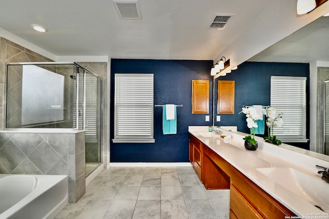 bathroom featuring vanity, tile patterned floors, and independent shower and bath