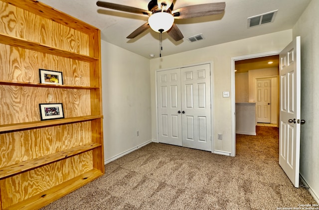 bedroom featuring carpet, a closet, and ceiling fan