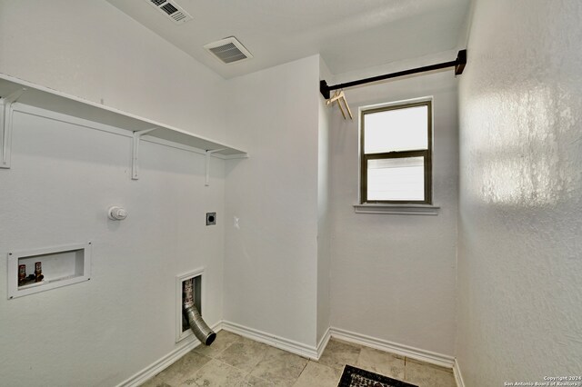 clothes washing area with electric dryer hookup, gas dryer hookup, and washer hookup