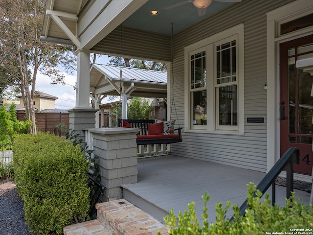 view of patio / terrace with ceiling fan and a porch