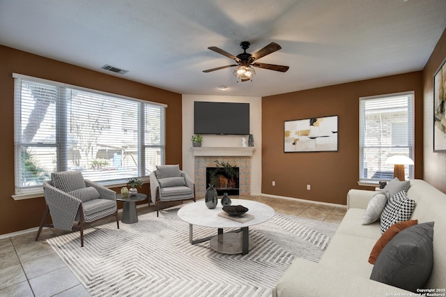 268 Fawn Rdg, Cibolo, TX 78108 - living area with healthy amount of natural light, a brick fireplace, and light tile patterned floors