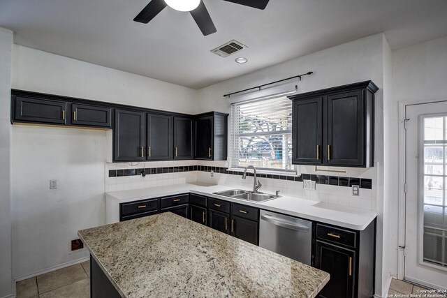 268 Fawn Rdg, Cibolo, TX 78108 - kitchen featuring a sink, stainless steel dishwasher, dark cabinets, ceiling fan, and a kitchen island