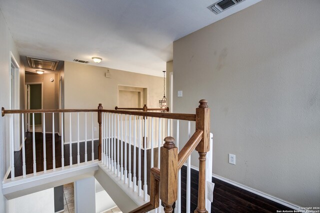 268 Fawn Rdg, Cibolo, TX 78108 - hallway with attic access, wood finished floors, an upstairs landing, and baseboards